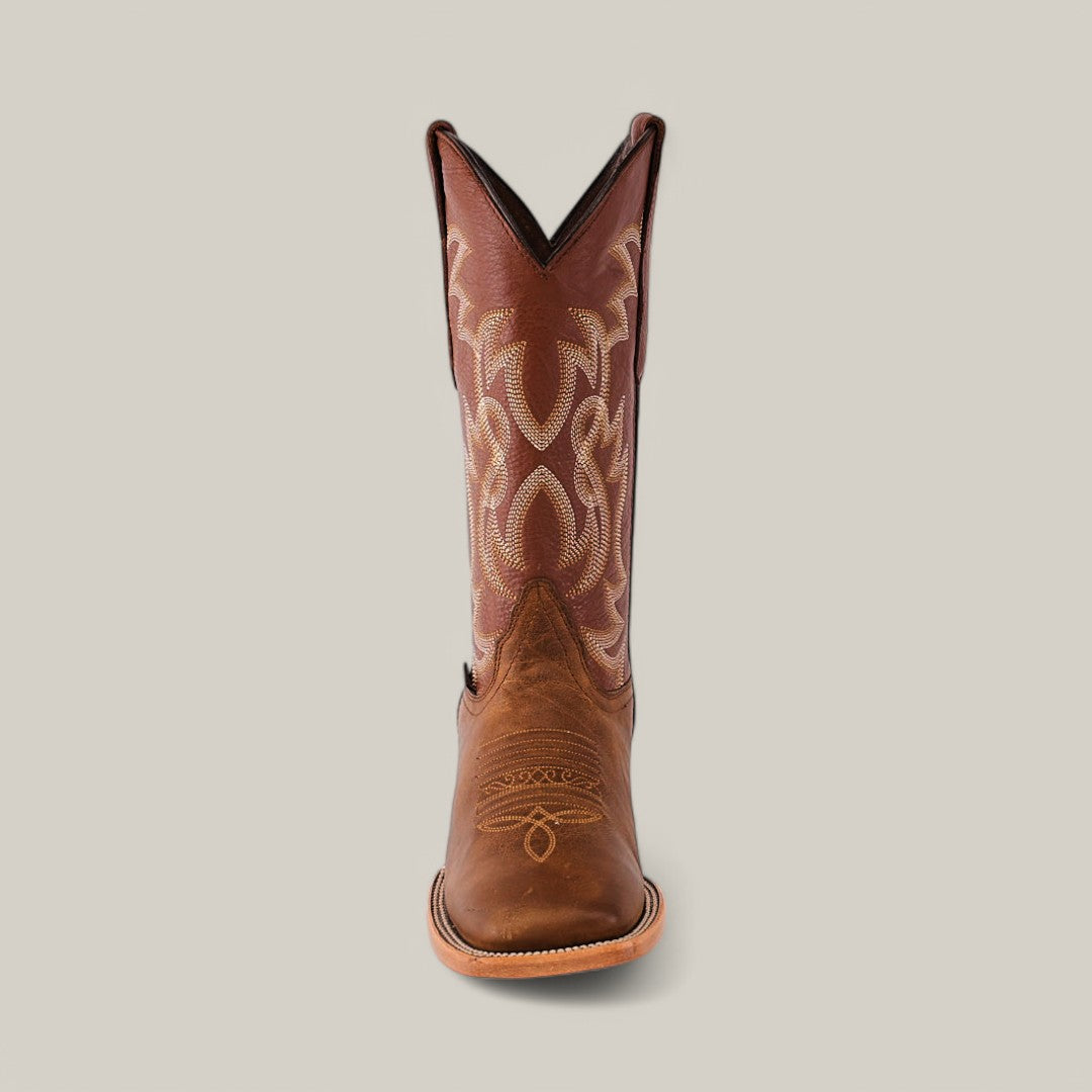 A single Siberia Honey cowboy boot, featuring intricate embroidery on the shaft, crafted from premium brown leather with a square toe, stands centered against a plain background.