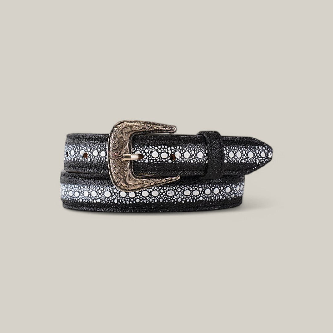 The Stingray Print Black Belt for kids combines style with a trendy touch, showcasing small white floral patterns and an ornate, antique-style Texas buckle, all neatly displayed on a neutral background.
