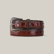 The Exotic Full Quilt Alligator Belt in brown, featuring a crocodile pattern and a platinum buckle with star engravings, is coiled on a plain background exuding elegance and style.