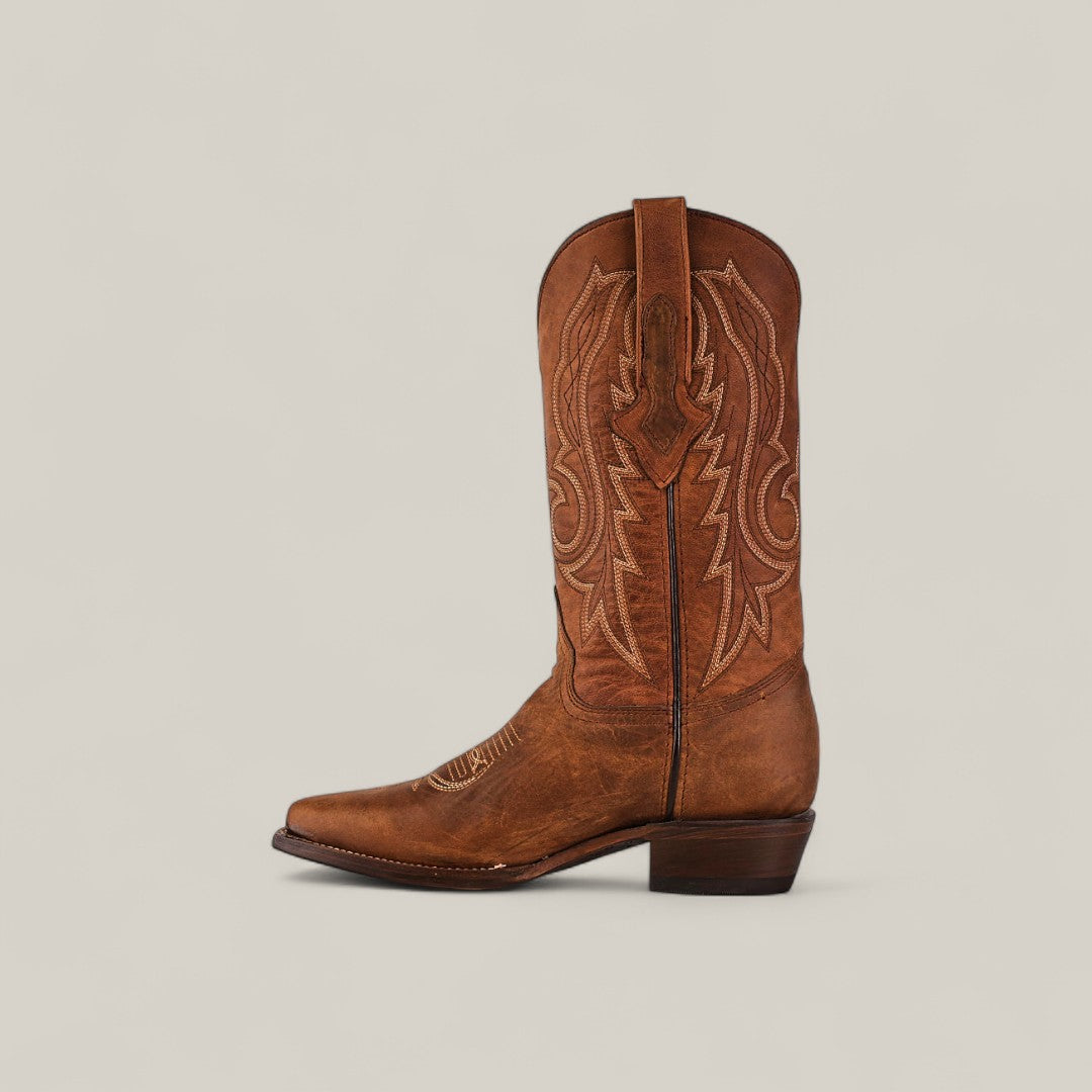 The Fresno - Tabaco - Snip Toe boot features brown cowhide leather, decorative stitching, a pointed snip toe, mid-calf height, and a short angled heel, highlighting quality craftsmanship against a plain light background.