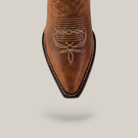 Top view of the Fresno - Tabaco - Snip Toe cowboy boot featuring quality brown leather, decorative white stitching on a pointed toe, and expert craftsmanship, set against a plain light background.
