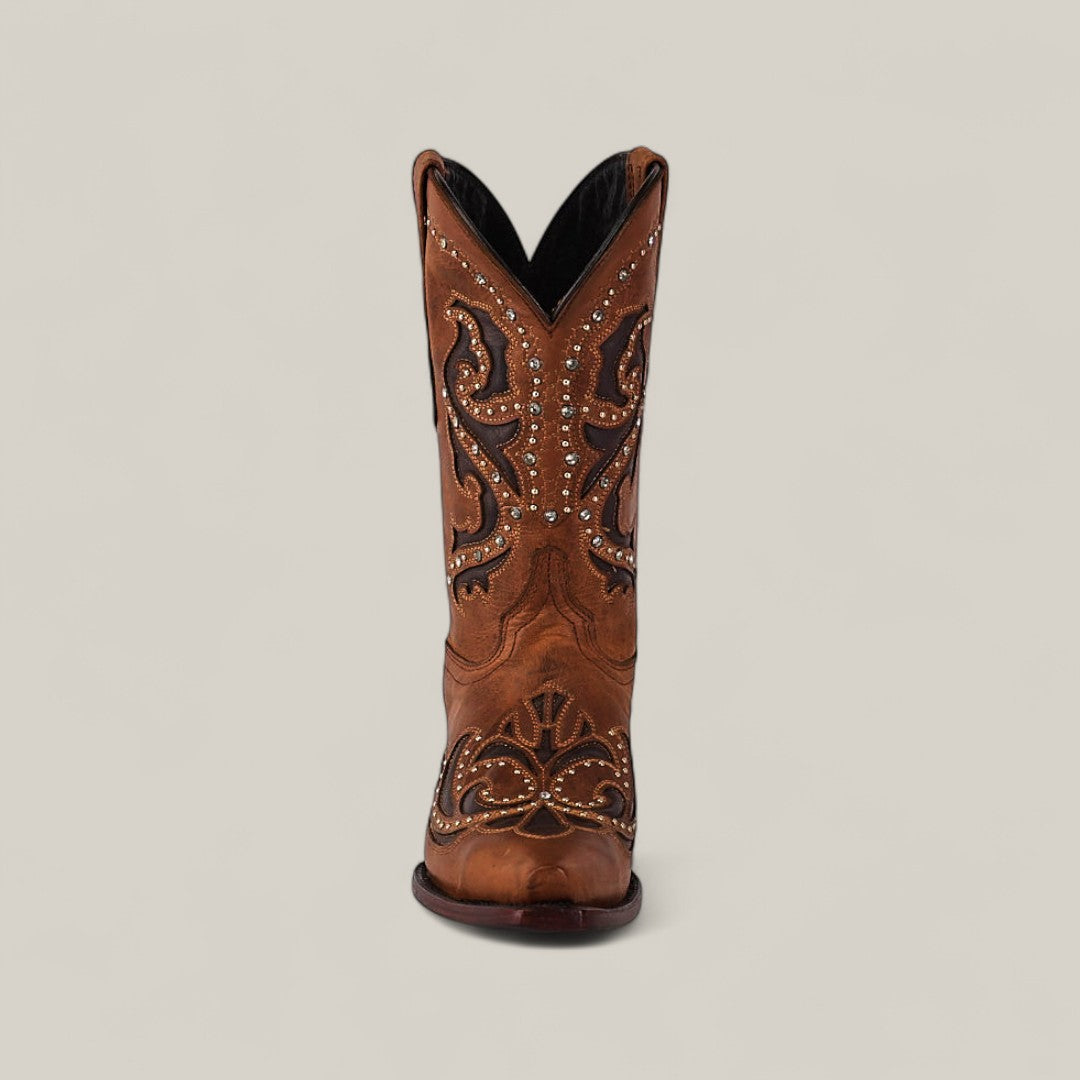 Front view of the Dolly - Brown - Snip Toe boot, showcasing intricate embroidery and decorative studs, set against a neutral background.