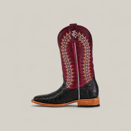 The Exotic Caiman Horn Back – Black – Square Toe from the Platinum Collection features a black textured foot, tall red shaft with yellow and white stitching, white pull strap, brown wooden sole, and a square toe design.