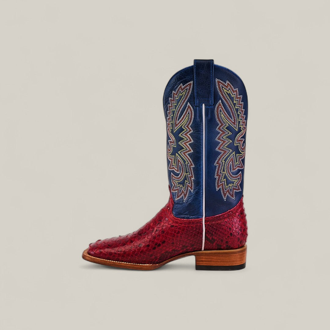 The Exotic Python - Ruby / Blue - Square Toe boot from the Platinum Collection features a textured red leather foot, blue upper with multicolored stitching, and a square toe design, shown in profile against a plain beige background.