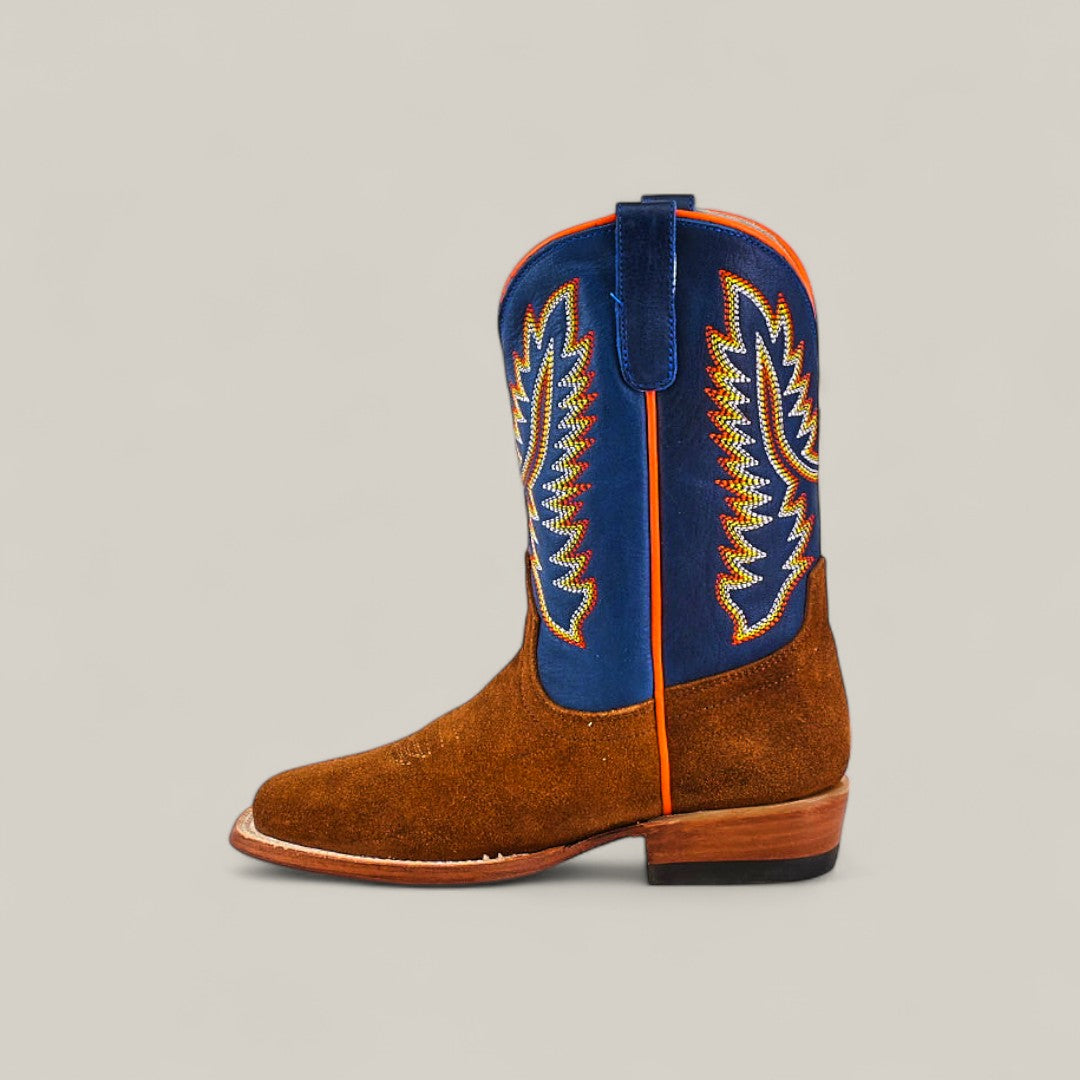 The Diamond Suede Ocre - Square Toe - Kids boot features a brown foot, blue leather shaft with colorful embroidery, and orange trim, displayed in profile on a plain beige background.