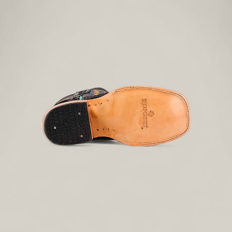 A single Exotic Python Black - Square Toe kids boot is shown sole-up on a plain background, displaying a tan leather sole with stitched edges, black rubber heel, and Double H branding near the arch.