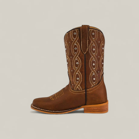 The Premiere Texas Copper - Square Toe Kids Boots feature brown leather, decorative white stitching, small silver studs on the shaft, a classic square toe, and a wooden heel, displayed on a plain light background.