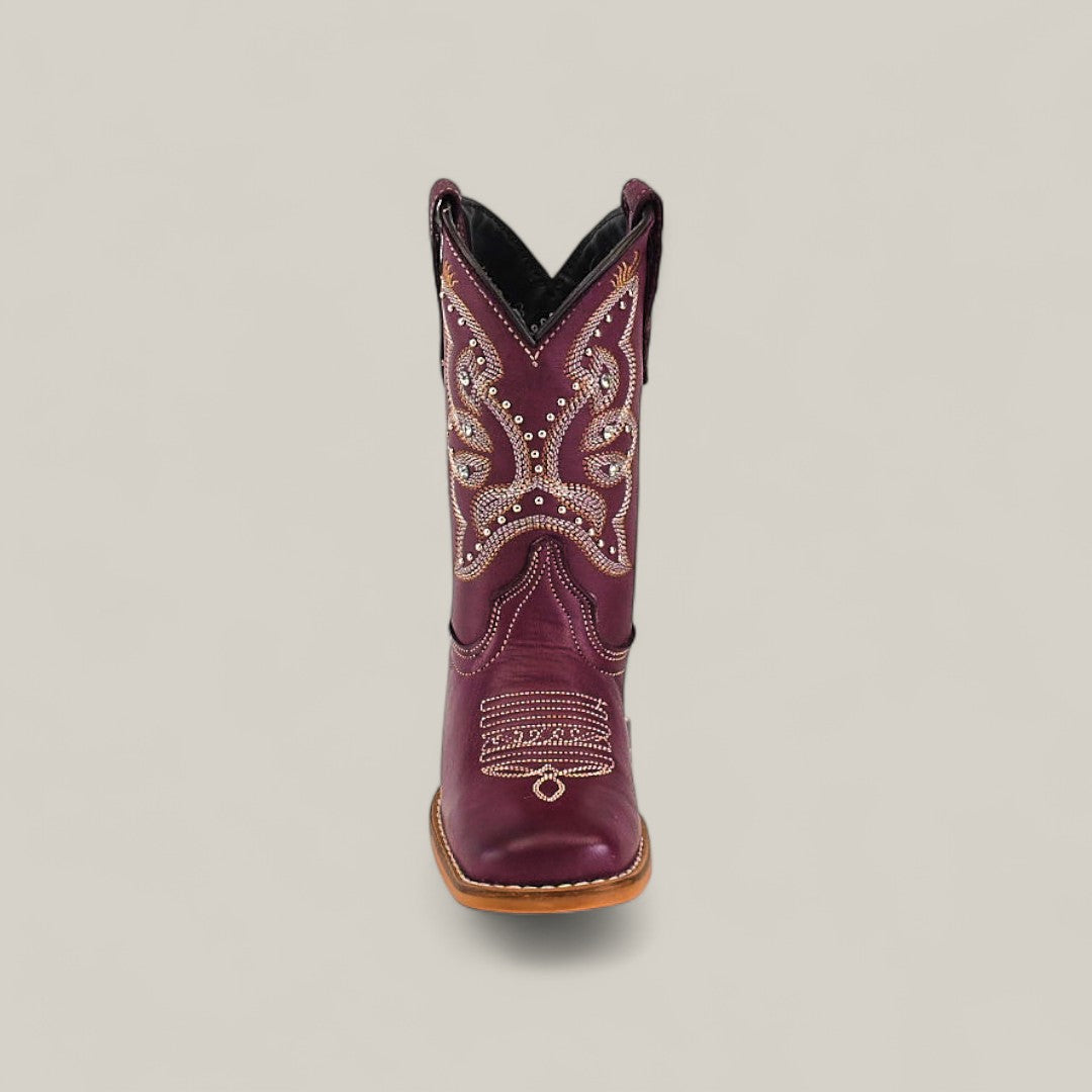 The Blake Purple - Square Toe Kids Boot in maroon features decorative white and tan stitching with small metallic studs, shown front-facing on a light background to showcase its stylish design and comfortable fit.