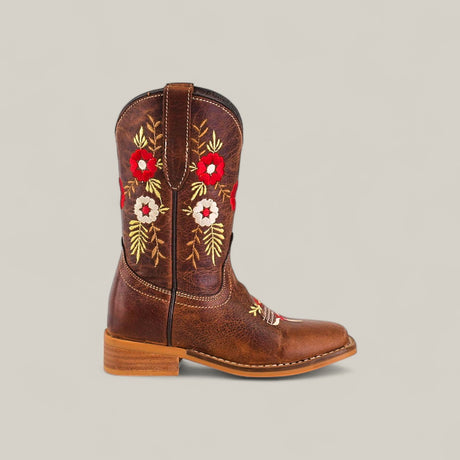 The Karo Brown - Square Toe - Kids Boots offer classic style with a low heel and red, white, and yellow floral embroidery on the shaft. Displayed from the side against a light gray background.