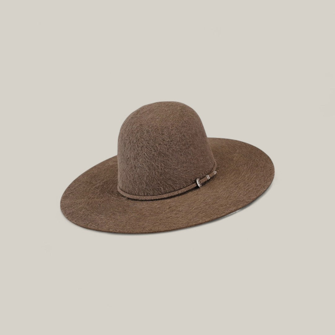 The 10X Grizzly - Tacchino is a wide-brimmed brown felt hat with an open, rounded crown, shown on a simple beige background.