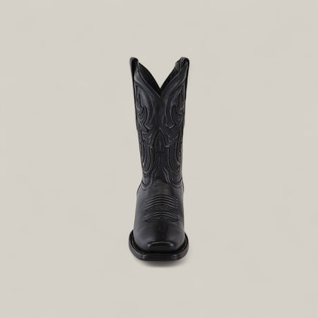 The Josie Full Black - Short Shaft - Narrow Square Toe boot is shown from the front, featuring decorative stitching and a classic black finish against a plain, light background for a chic look.