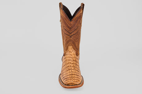 The Exotic Caiman Belly - Antique - Square Toe boot, featuring intricate shaft stitching and a textured alligator-patterned toe, is shown against a plain light gray background.