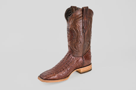 The Exotic Caiman Horn Back - Brown - Square Toe boot features textured caiman leather with a smooth upper, decorative stitching, and a light wooden heel, shown against a plain gray background.