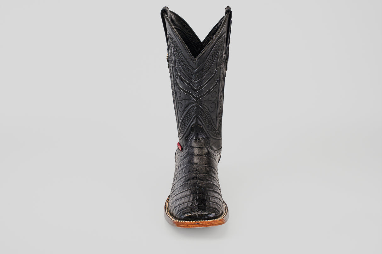 The Exotic Caiman Belly - Black- Square Toe boot, crafted from caiman leather with detailed stitching and a textured pattern, is displayed from the front against a plain light gray background.