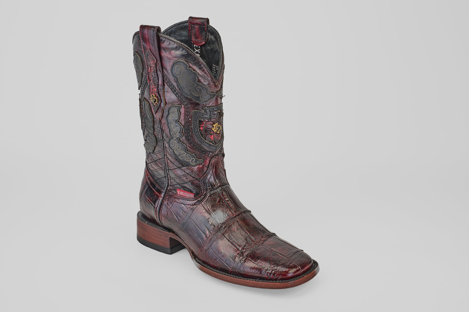 A single Exotic Alligator - BlackCherry- Square Toe cowboy boot, featuring dark alligator leather, square toe, low heel, and decorative shaft stitching, displayed on a plain white background.