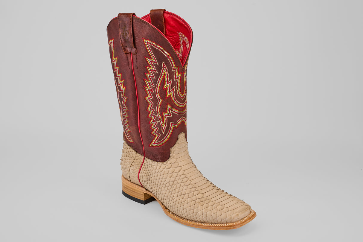 The Braxton - Cappucino - Square Toe is a luxury mens boot with a tan, python-textured lower half and tall, dark red shaft with yellow stitching and pull straps, finished with a wooden heel for timeless Western appeal.