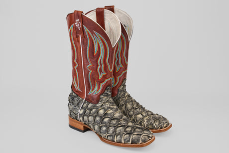 The Robinson - Newspaper - Square Toe boots are limited edition cowboy boots with textured gray Purarucu leather on the foot and dark red shafts with colorful stitching, shown against a plain light background.