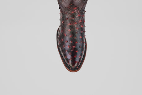 A single Exotic Full Quilt Ostrich boot in Black Cherry with a round toe and textured, raised quill pattern is displayed from above on a plain white background.