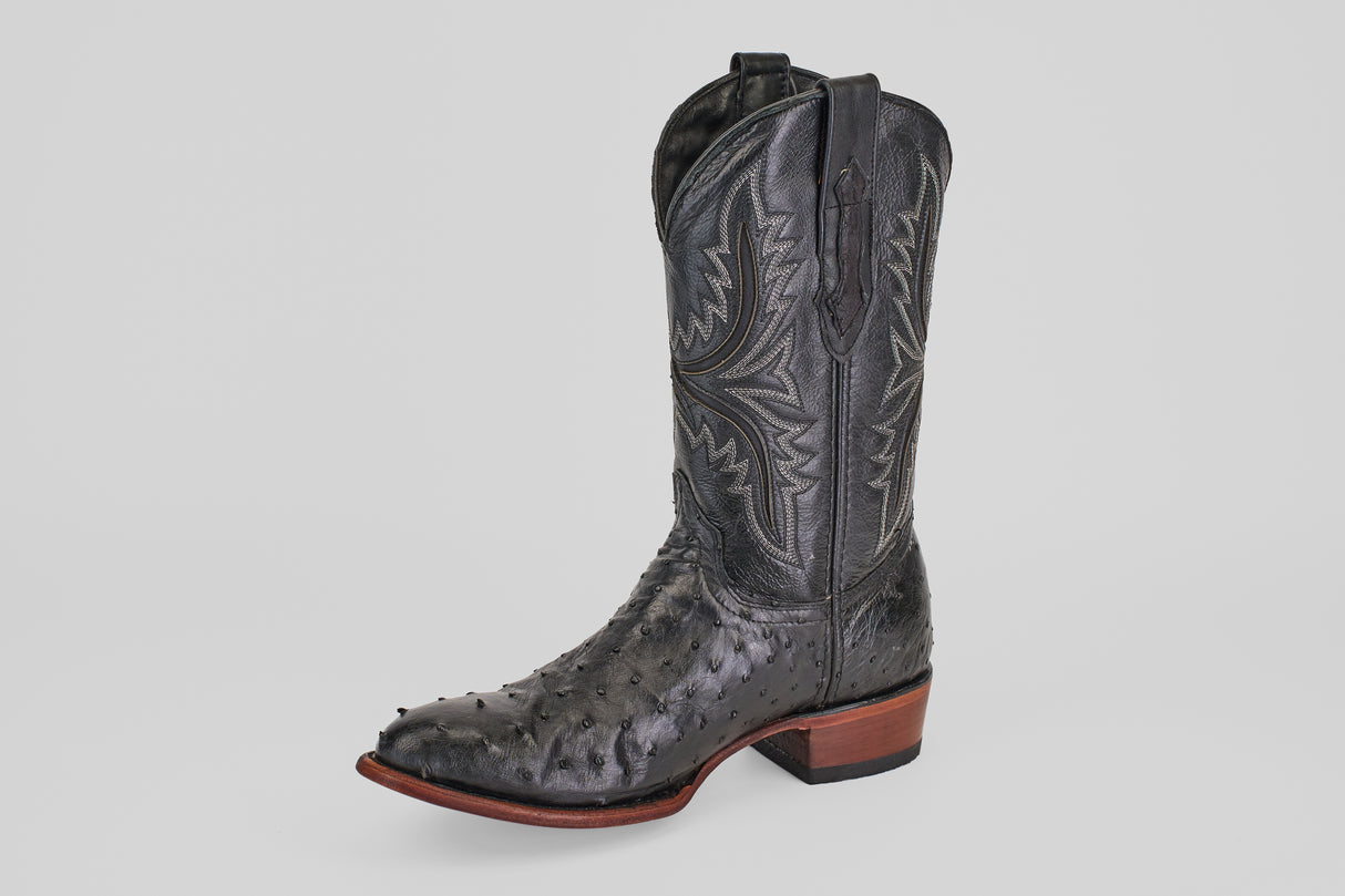 The Exotic Full Quilt Ostrich - Black - Round Toe boot features full quill ostrich leather, classic round toe design, and decorative stitching, embodying timeless Western style against a light background.