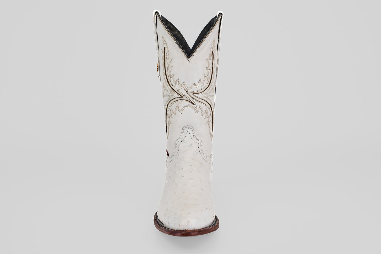 A single white Austin cowboy boot with a round toe and decorative stitching, viewed from the front against a plain light background. Style: Austin - White - Round Toe.
