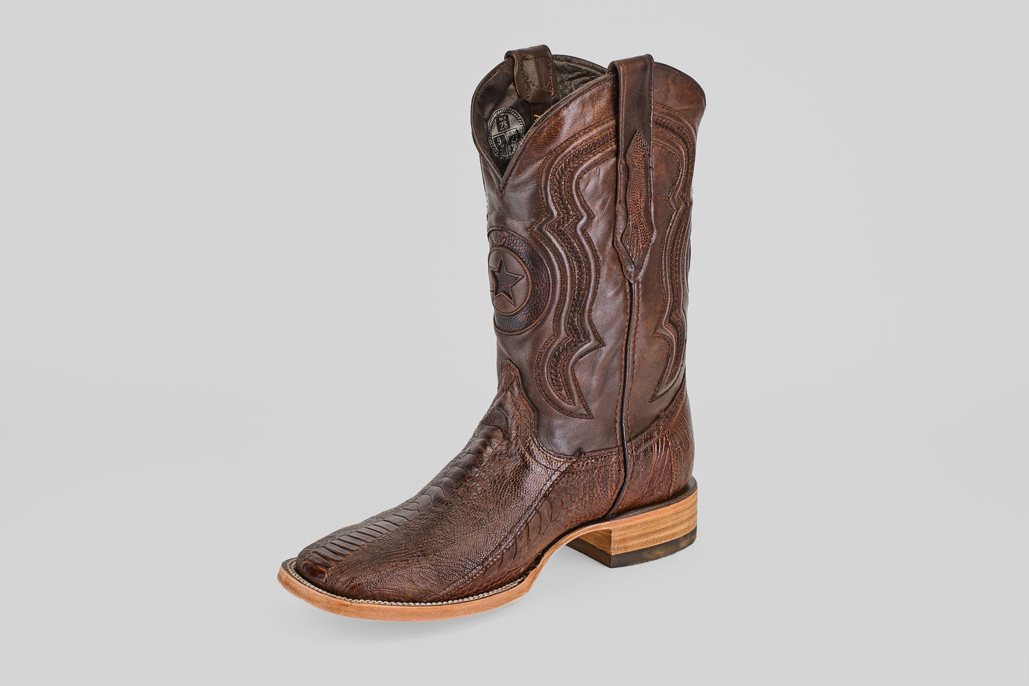 The Austin Leg - Brown - Square Toe cowboy boot features decorative stitching, a square toe, and a wooden heel, shown upright against a plain light gray background.