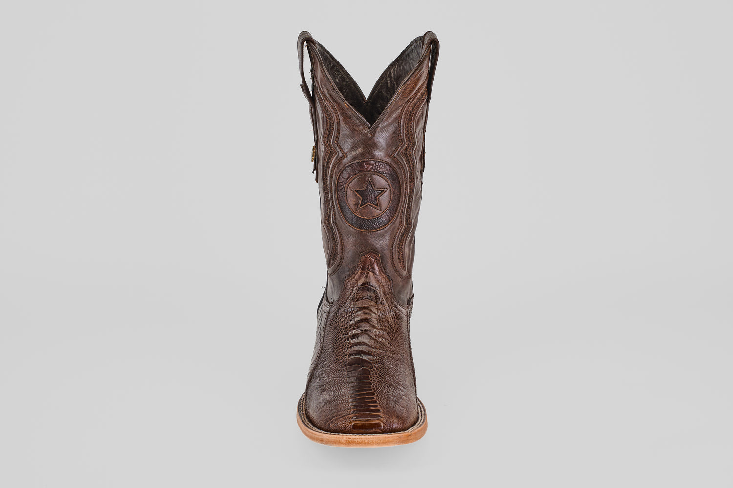 The Austin Leg - Brown - Square Toe is a single brown western boot with decorative stitching, a star emblem on the front, and a light-colored sole, photographed on a plain white background.
