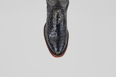 A top-down view of the Tanner - Black - Round Toe cowboy boot in textured Python Negro Oval leather with a reptile-like pattern and brown sole, set against a plain white background.
