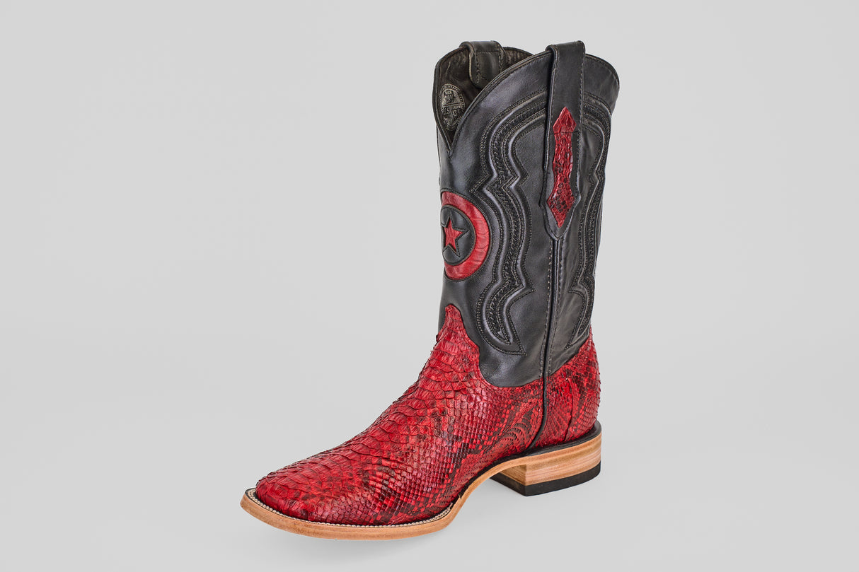 The Tanner - Ruby - Square Toe cowboy boot features a bold Python Rojo foot, black leather shaft with star designs and decorative stitching, plus a light tan wooden sole.