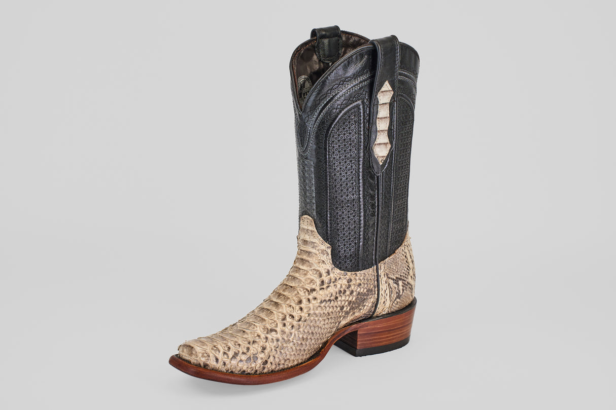 The Tanner - Natural - Narrow Square Toe cowboy boot features a black leather upper, beige snakeskin-textured lower section, narrow square toe, and wooden heel—showcasing classic Western style on a plain light background.