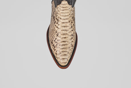 A top view of the Tanner - Natural - Snip Toe boot in beige python snakeskin leather with a brown sole, shown against a plain light grey background.