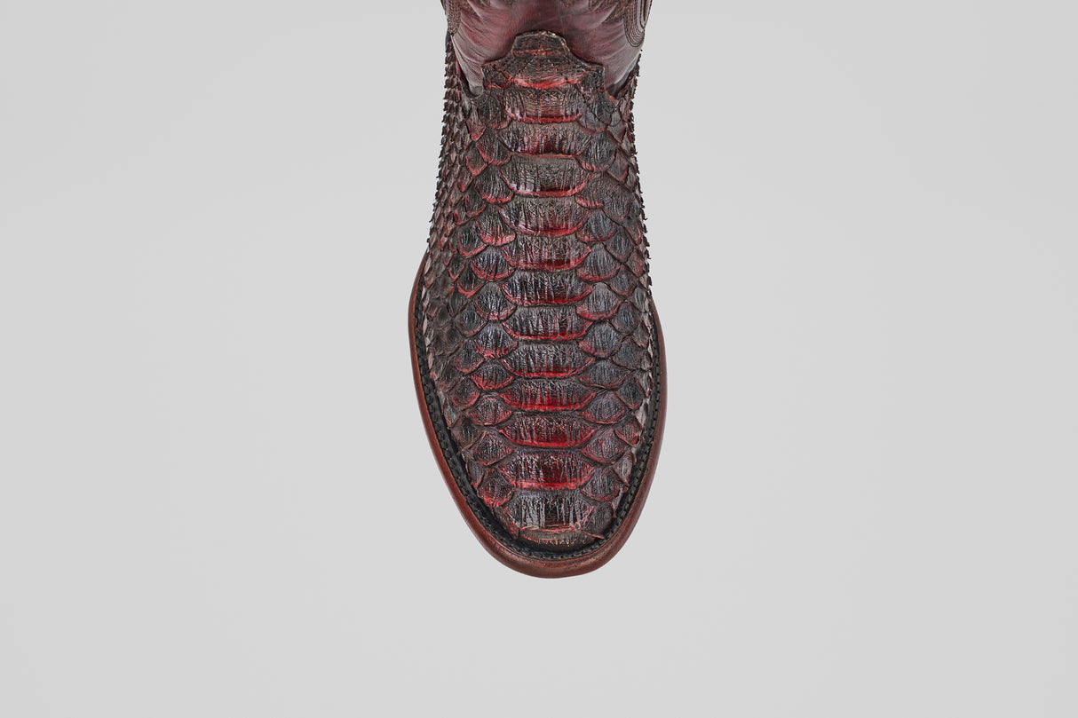 A close-up, top-down view of the round toe of the Tanner Jumbo - Black Cherry cowboy boot in textured Python leather, shown against a plain white background.