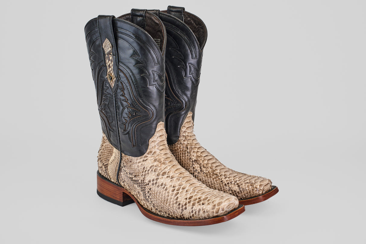 The Tanner - Natural - Rodeo Toe cowboy boots feature python natural leather on the foot, dark brown uppers with decorative stitching, and a wooden heel, shown on a light gray background—ideal for your next rodeo.