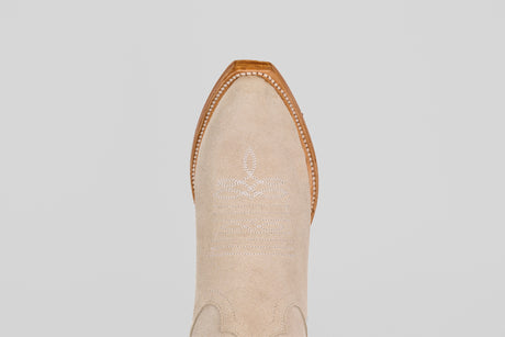 A top-down view of the Allison Ivory - Tall Shaft - Snip Toe boot highlights its ivory color, snip toe, white decorative stitching, and brown leather trim, exemplifying classic women's western boot style.