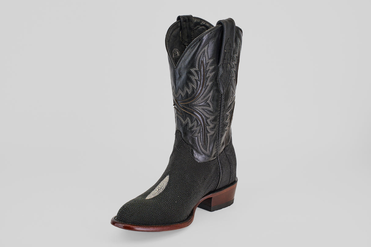 The Ranger – Black – Round Toe men's cowboy boot features a black design with detailed shaft stitching, a white patch on the toe, and a brown sole—shown on a plain light gray background.