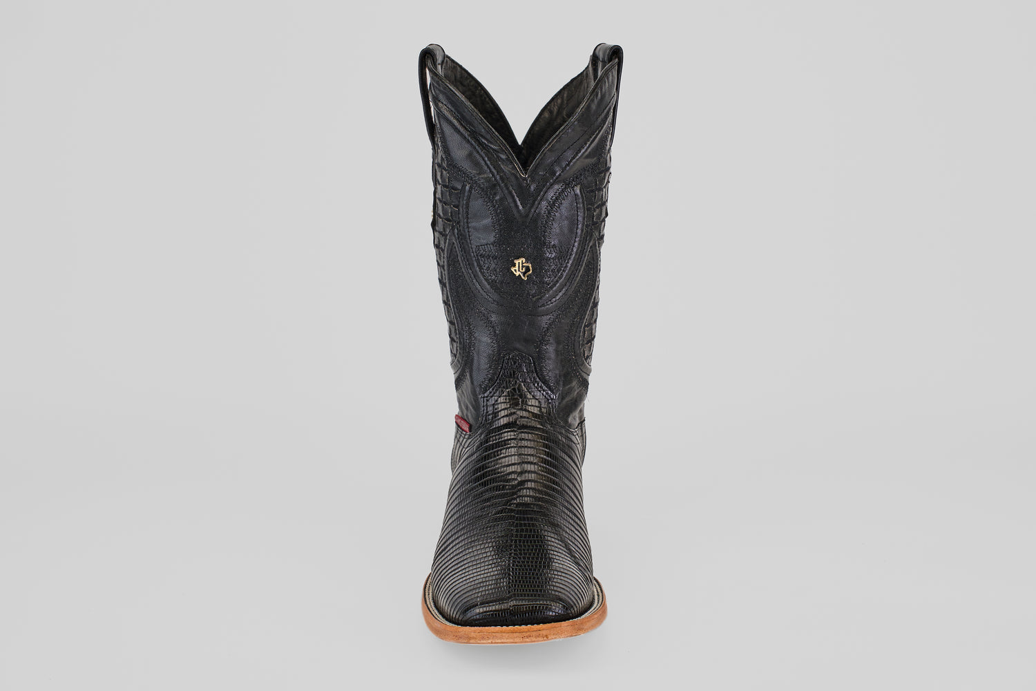 The Blaze – Black – Square Toe cowboy boot, made from genuine lizard leather with a tan sole, is displayed front-facing against a plain light gray background.