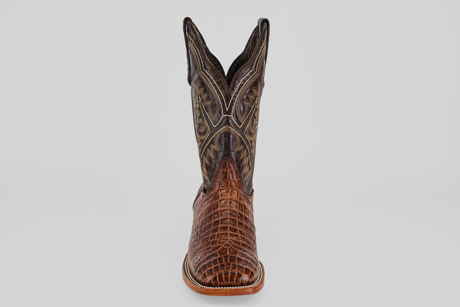The Caiman Belly Choco - Embossed Leather - Square Toe (E423) boot features a brown alligator-style embossed foot and detailed stitching on the tall shaft, displayed from the front on a plain light background.