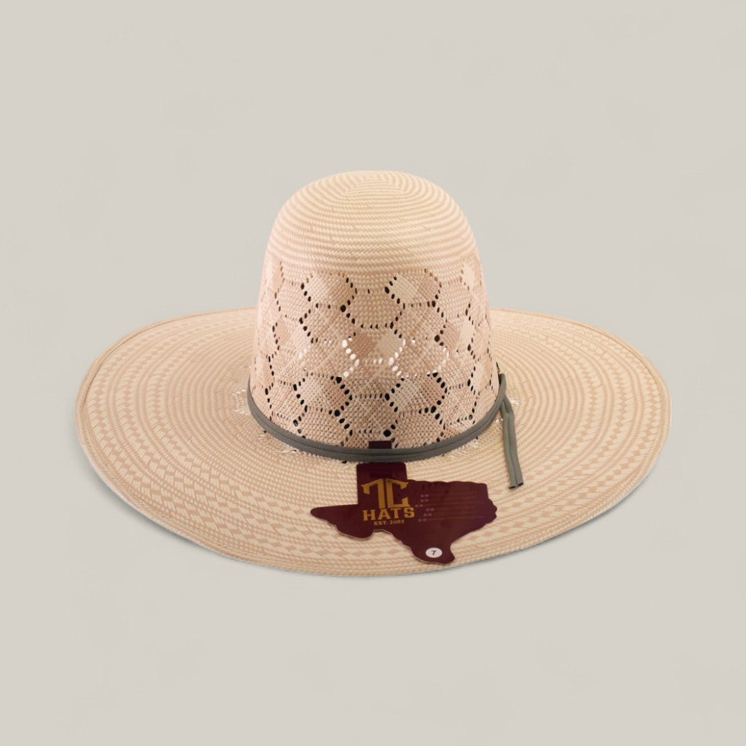 The 30X Hexagon - Open Crown is a light straw hat with a wide brim, hexagon open crown, and a Texas badge with TT HATS on the front—a standout choice for those seeking unique style.