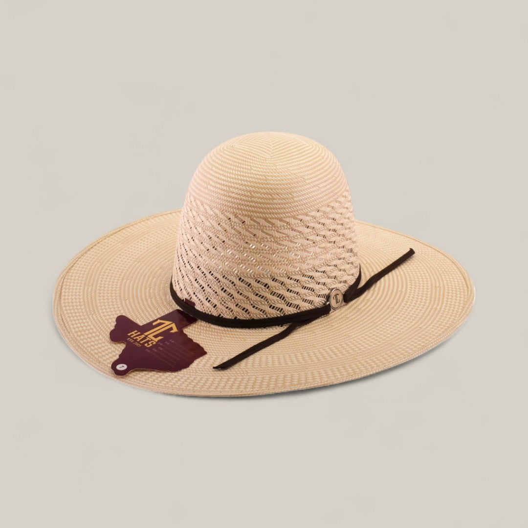 The 30X Worm - Open Crown is a wide-brimmed, light tan straw hat with a black band and decorative tag, shown on a plain background—ideal for anyone seeking unique hat styles.