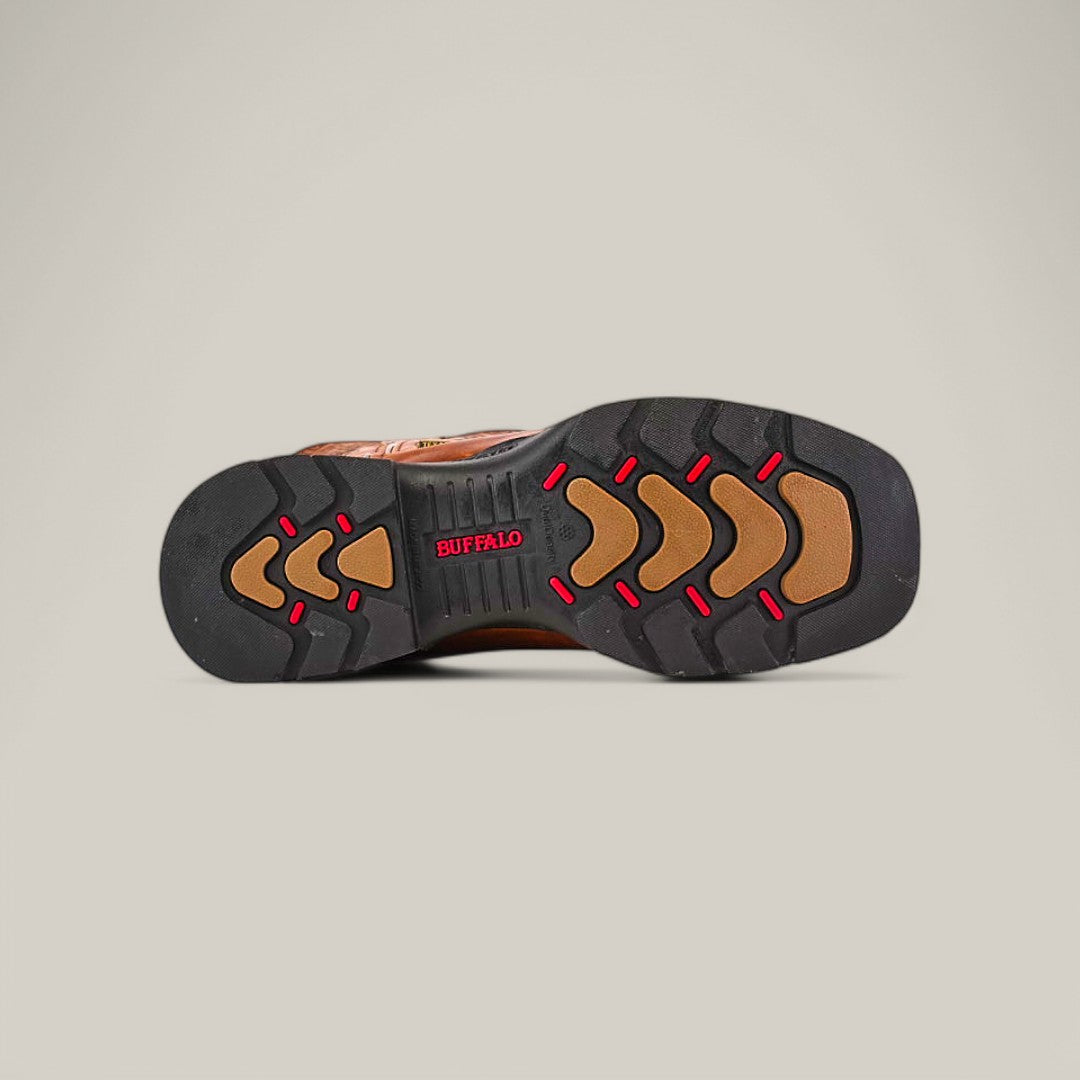 The image shows the sole of a shoe from the Crater Honey Soft Toe (E6087) against a light gray backdrop. This black sole, accented in red and brown with chevron patterns and red BUFFALO text, highlights the durability typical of Texas Country Work Boots.