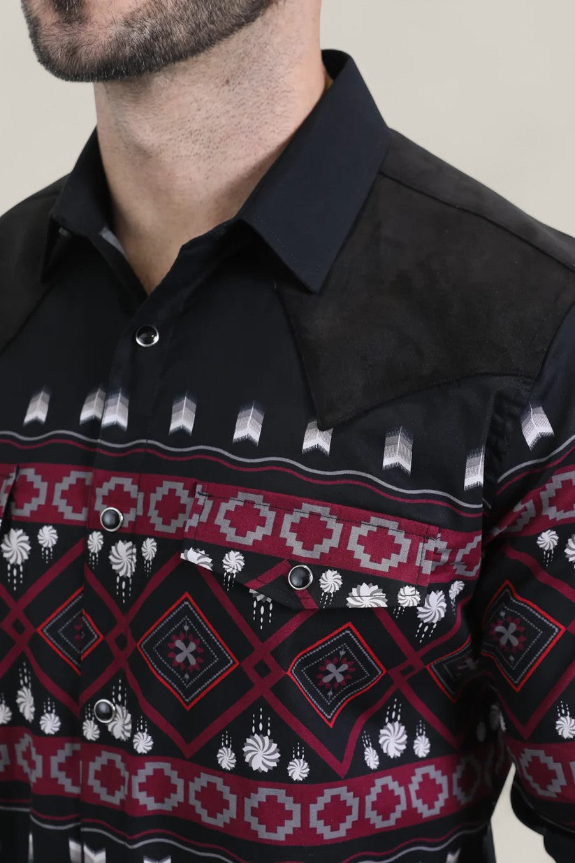 A man wears the Mens Western Modern Fit Cotton/Spandex Long Sleeve Black Shirt with Snaps (WPL10750), featuring a modern fit, bold maroon, white, and gray geometric chest pattern, black suede shoulder accents, and a pointed collar.