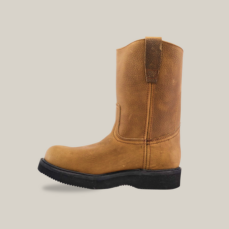 The Tan Roper - Laredo Sole - Soft Toe is a tan mid-calf leather boot made from premium cowhide, featuring a round toe and the signature Tan Roper Laredo Sole. Displayed in profile against a plain white background, the boot has minimal stitching, a slight heel, and embodies classic work boot style.