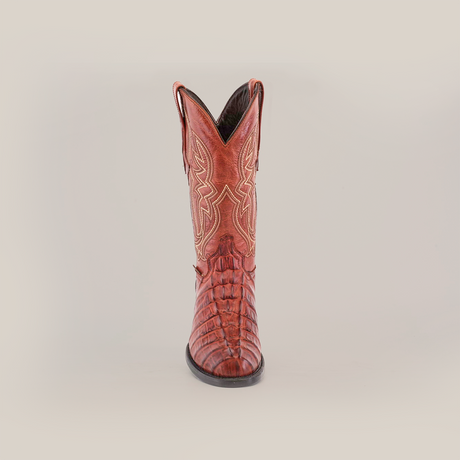 A single Crocodile Tail Print Cogñac boot is displayed against a white background, featuring intricate stitching, a round toe, decorative patterns along the shaft, and a premium leather sole for comfort and durability.