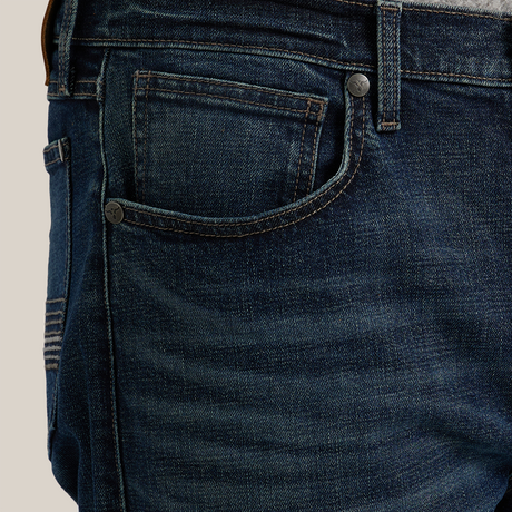 Close-up of someone wearing Wrangler 20X Sunnybrook Dark Wash Extreme Relaxed Straight Stretch Denim Jeans (112344469) and a gray shirt, focusing on the premium denims side, front pocket, and belt loops.