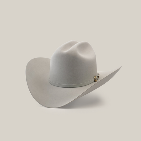 A light gray cowboy hat with a wide brim and a decorative band, set against a plain white background.