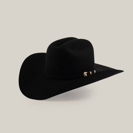 A black cowboy hat with a wide brim and a decorative silver detail on the hatband, displayed on a plain light background.