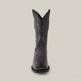 The Alligatoar Horn Back Print Black - Square Toe boot is front-facing, showcasing exquisite leather craftsmanship with a square toe and crocodile pattern. Decorative stitching highlights its elegance against a plain backdrop.