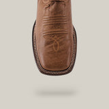 The Sierra Cinnamon - Square Toe boot is a brown cowboy boot with premium leather craftsmanship and intricate toe stitching, suspended against a light, neutral background. This Western-style boot showcases a square toe and detailed embroidery.