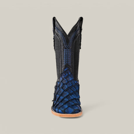 Front view of the Exotic Pirarucu Fish - Dark Blue Square Toe boot, featuring a textured lower half reminiscent of fish scales and a black upper with decorative stitching, set against a neutral gray background. This boot has pointed V-shaped shafts, adding an exotic touch.