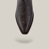 A close-up of the snip toe on the Rush - Brown boot, showing detailed stitching in dark brown leather, set against a plain beige background with a soft shadow beneath.