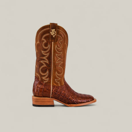 The Exotic Caiman Belly Tail - Brandy - Square Toe boot showcases a textured caiman belly lower, decorative stitched shaft, low heel, square toe silhouette, and a pull tab with embroidered logo against a light background.